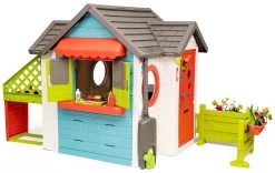 Häuschen Mit Gartenrestaurant Chef House DeLuxe Smoby Und Eine Grüne Sitzecke Und Einen Zaun